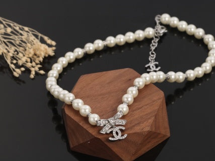 Chanel Romantic Pearl Bow Charm Necklace
