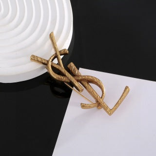 YSL Twisted Rope Monogram Gold Brooch
