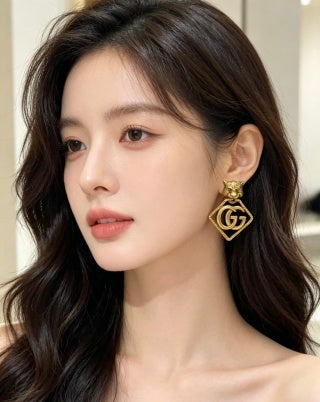 Gucci Interlocking G Lion Head Geometric Stud Earrings