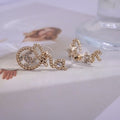 CHANEL Linked CC Chain Texture Stud Earrings