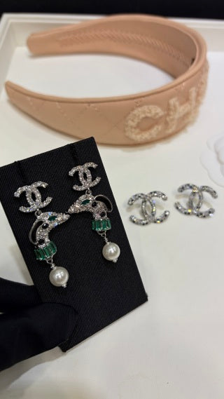 Chanel Silver Pearl Earrings with Dog Motif and Full Pavé Diamonds