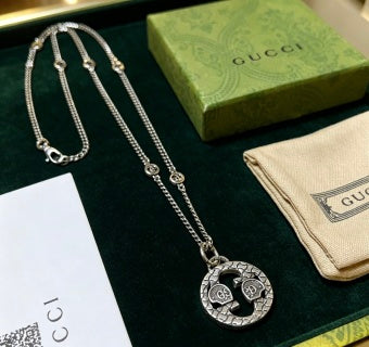 Gucci GG Medallion Engraved Long Pendant Necklace