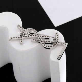 YSL Cassandre Crystal Monogram Brooch