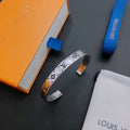 Louis Vuitton Silver Monogram Edge Cuff Bracelet